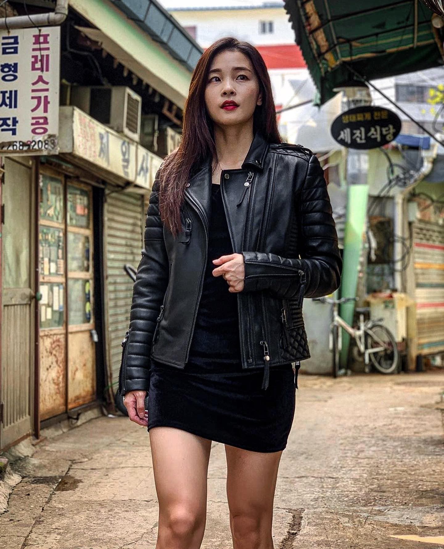 Customer wearing a black leather biker jacket