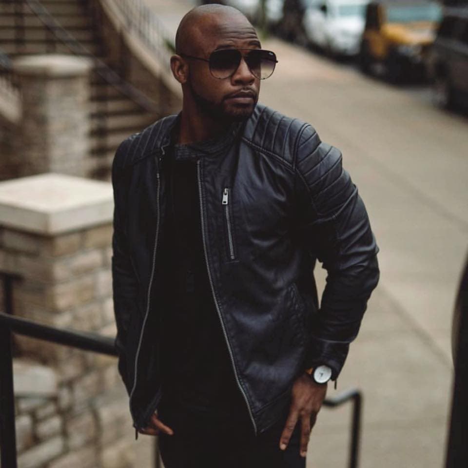 Customer in slim brown leather jacket