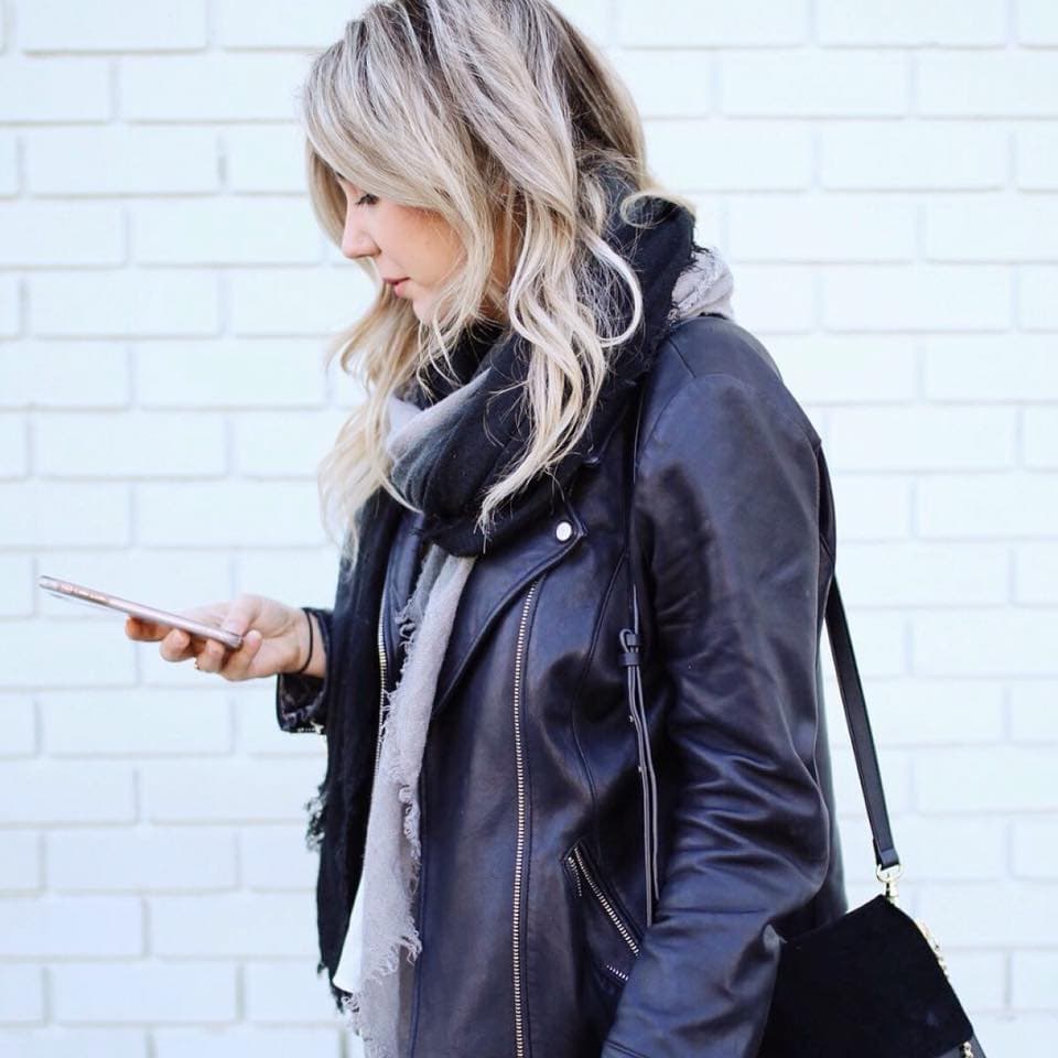 Model in dark brown leather jacket